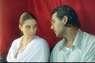 Left to right: Lisa Ray as Kalyani and John Abraham as Narayan. 